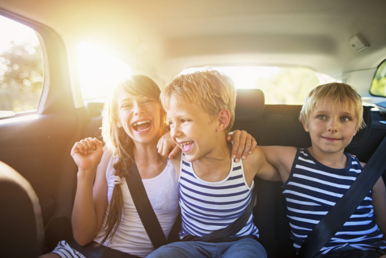kids-having-fun-in-car-on-a-road-trip