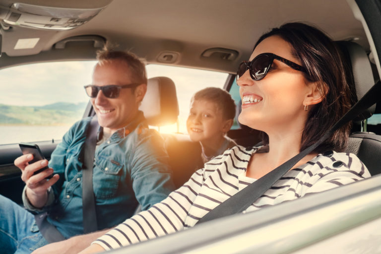 happy-family-riding-in-a-car