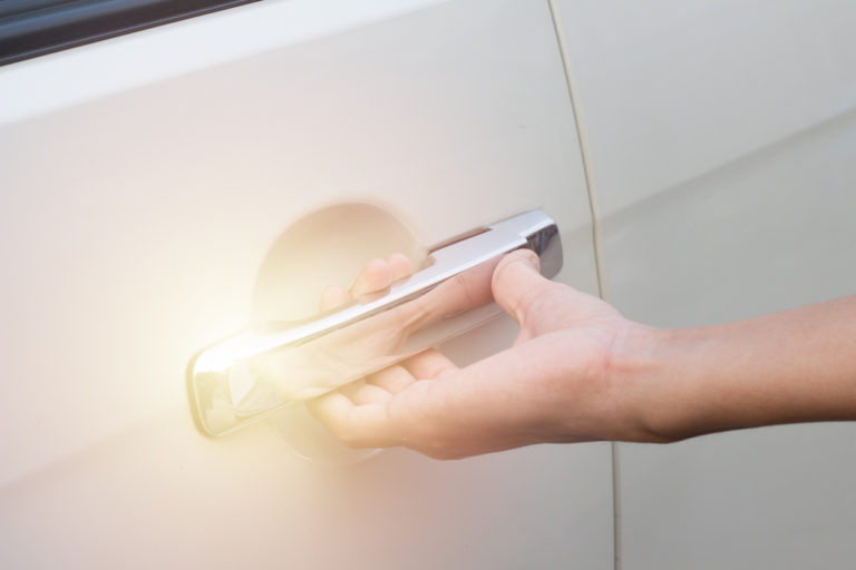 the-young-man-is-opening-the-car-doorclose-up-hand-and-car-door